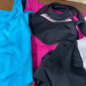 Lot of 3 SkirtSports tanks. Shelf bra cross-style back. Size S.